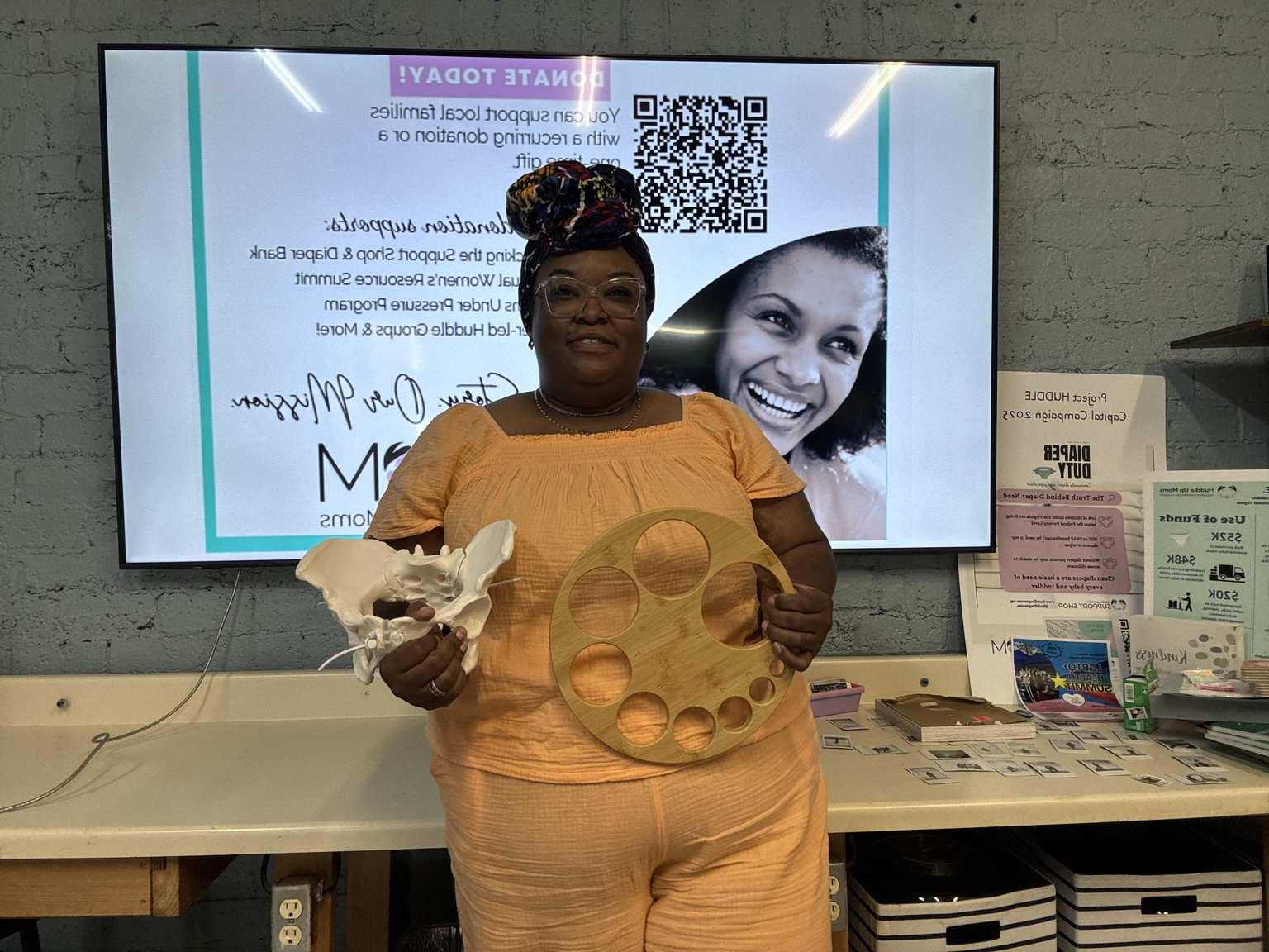 Chantel facilitating a hands-on maternal health training demonstration